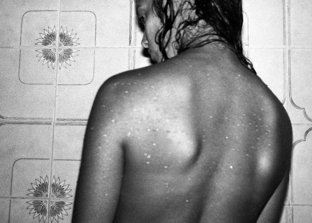 Woman with water drops on the back
